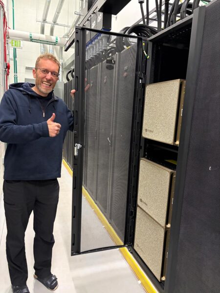 Killian looking excited standing next to the server cabinet